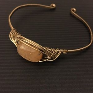 Gold bracelet with light peach stone